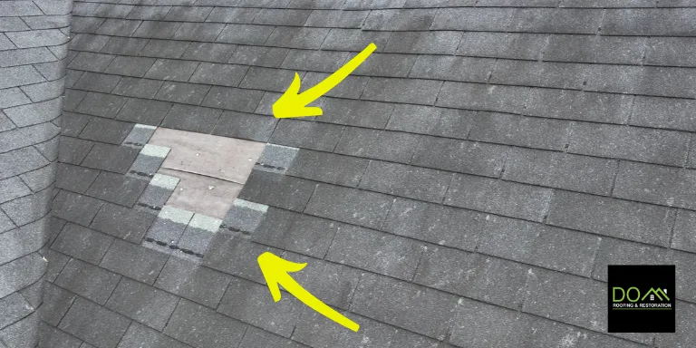 A bad roof repair in Lawrenceville showing mismatched shingles and a temporary patch, a common cause for future leaks found by Dom Roofing & Restoration.