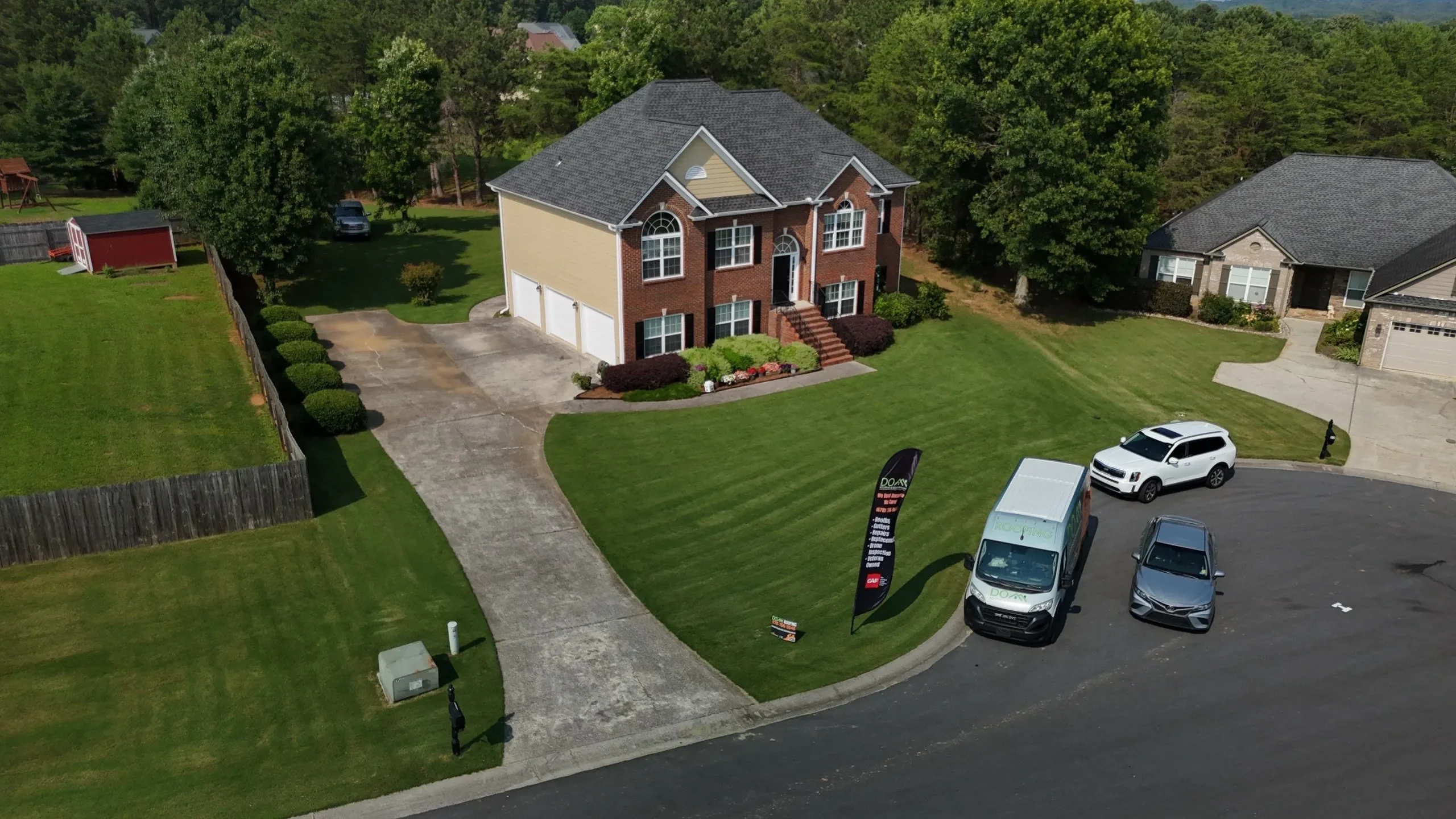 A beautiful new architectural shingle roof on a home in Buford, the final result of a successful insurance claim handled by Dom Roofing & Restoration.