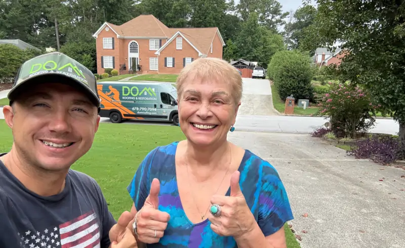 Kathleen Harper from Atlanta GA giving a 5-star customer review for Dom Roofing & Restoration after a roof replacement with excellent quality and service