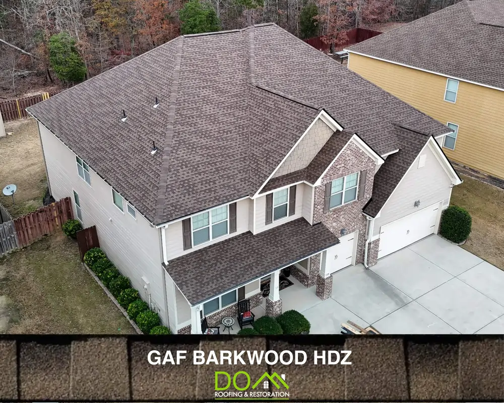 Barkwood Timberline HDZ roof blending with natural surroundings by Dom Roofing & Restoration Sugar Hill GA