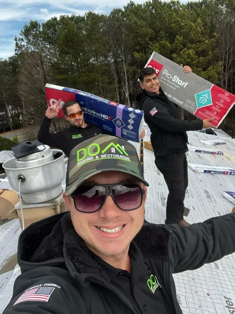 Dom Roofing & Restoration professional crew installing new roof on Buford GA residential home with safety equipment