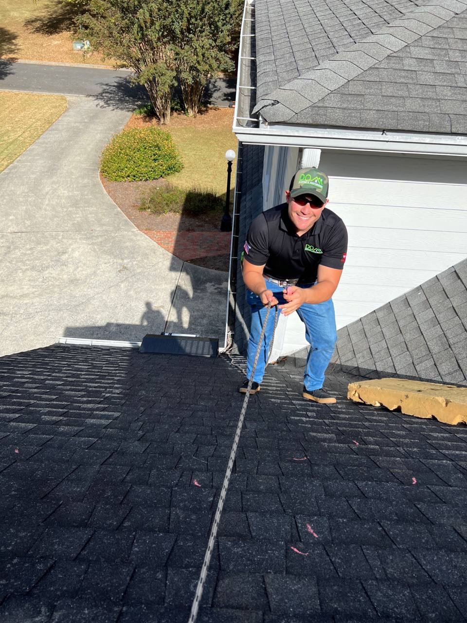 Best Roofing Contractors in Johns Creek, GA 2 Dom Roofing crew member working on an architectural shingle roof, serving Johns Creek, GA