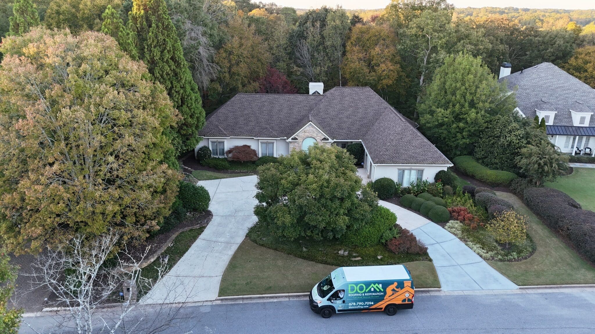 Lawrenceville, GA Roofing | Dom Roofing & Restoration 2 Dom Roofing crew replacing storm-damaged shingles on a roof in Lawrenceville, Georgia