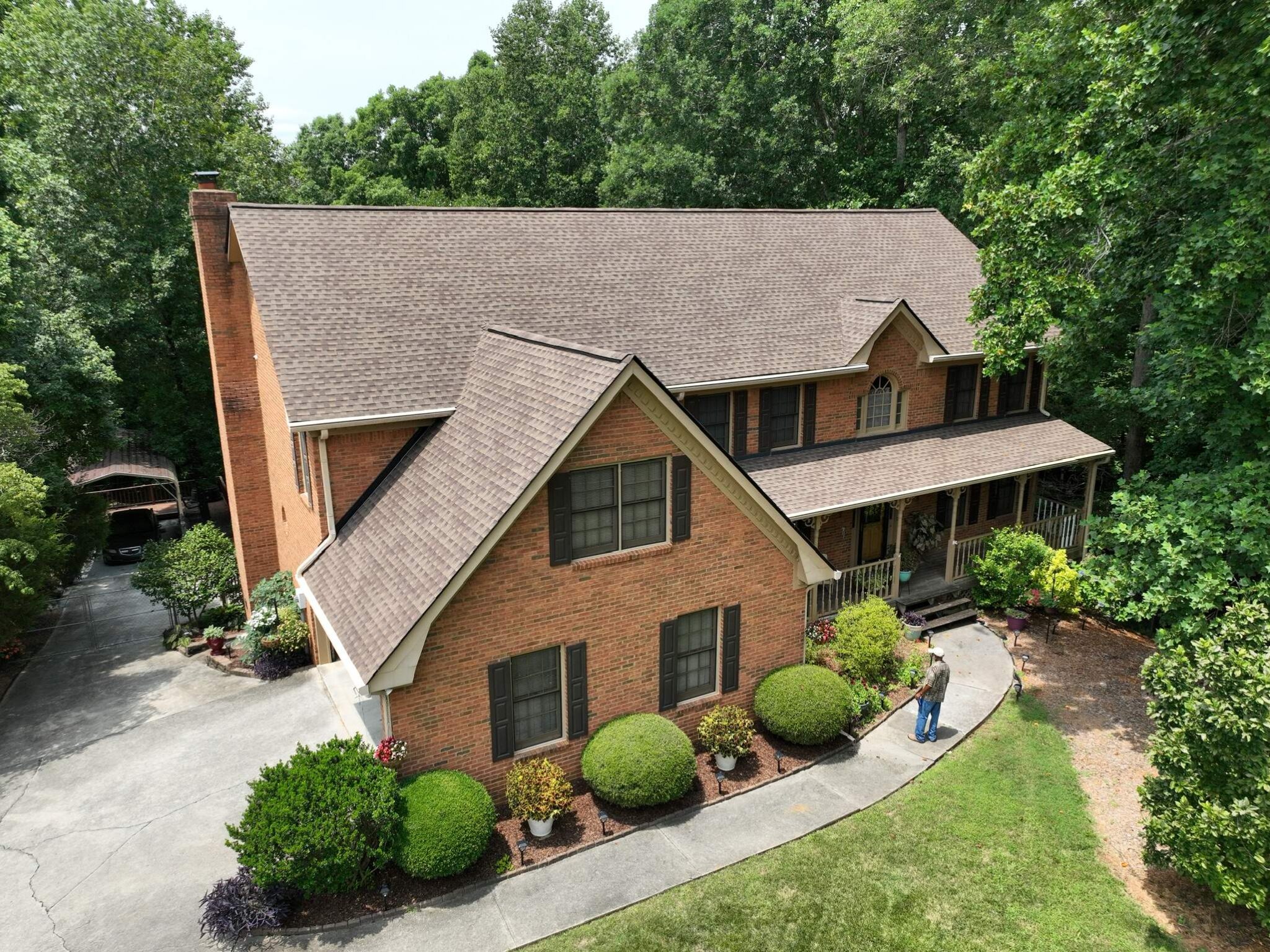 Snellville, GA Roofing | Dom Roofing & Restoration 1 Completed brown architectural shingle roof replacement on a brick colonial home in Snellville, GA by Dom Roofing