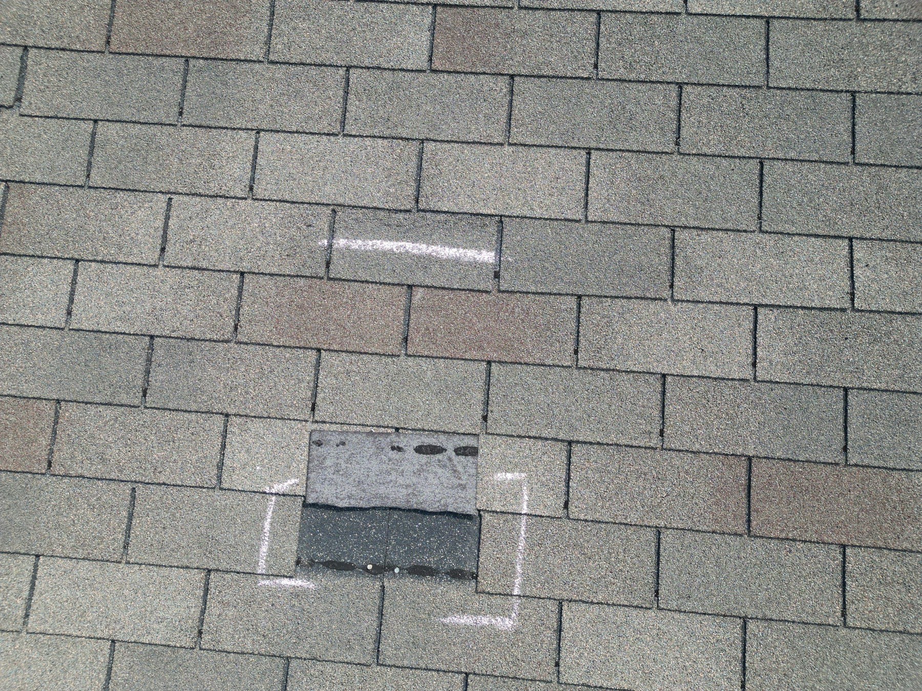 Architectural Shingles vs. 3-Tab: Georgia Guide 1 Three-tab shingles with an inspection area outlined in chalk