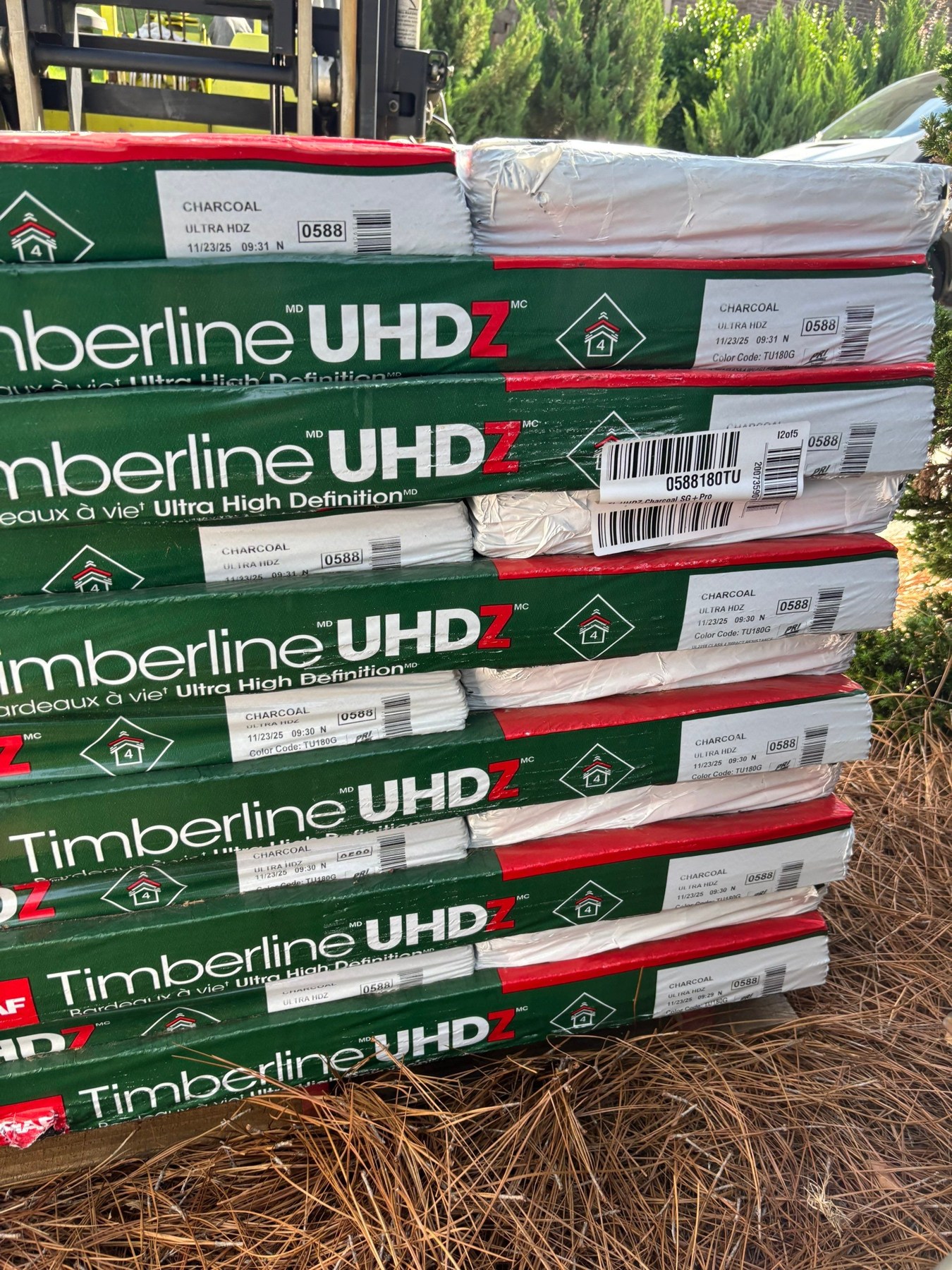 Class 4 Impact-Resistant Shingles: Georgia Guide 1 GAF Timberline UHDZ shingle bundles at a roofing project
