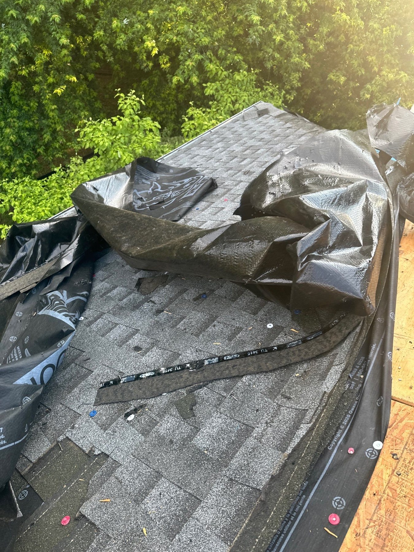 Roof Underlayment: Felt vs. Synthetic for Georgia Homes 1 Existing roof covering and underlayment pulled back during tear-off