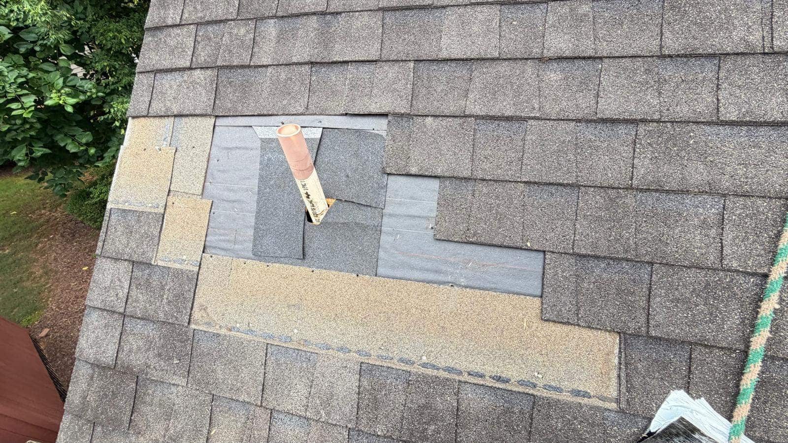 Roof Leak Repair Cost in Georgia (2026 Pricing Guide) 1 Shingles opened around a roof repair area