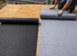 Roofing felt compared with synthetic underlayment on plywood roof decking